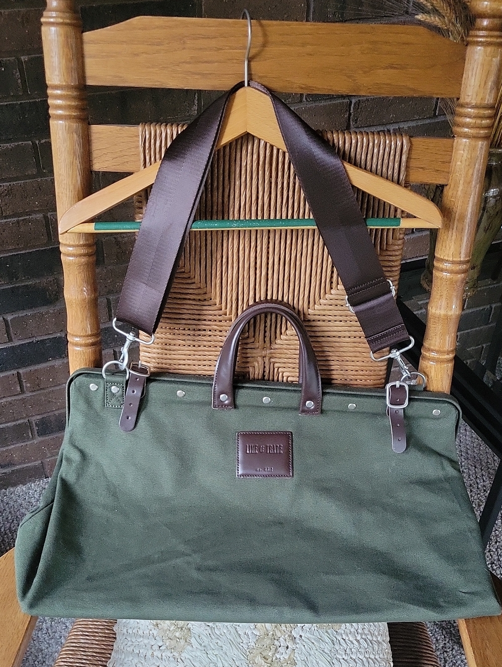 Line of Trade green military duffle sack with brown canvas strap